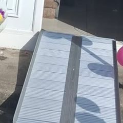 Folding wheelchair ramp