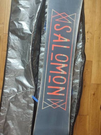 Salomon snowboard with Rossignol bindings in travel case