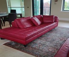Natuzzi red leather corner sofa or can be separate as shown