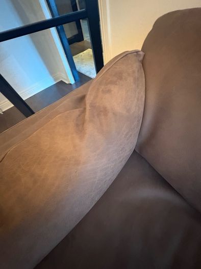 Leather sofa with original harvey Norman tag still attached