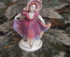 Vintage porcelain lady figurine with hat