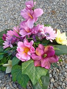 Elegant faux flowers grave arraignments