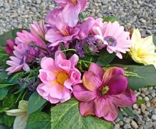 Elegant faux flowers grave arraignments