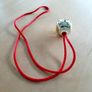 2026 Gold bell on red cord Image 2