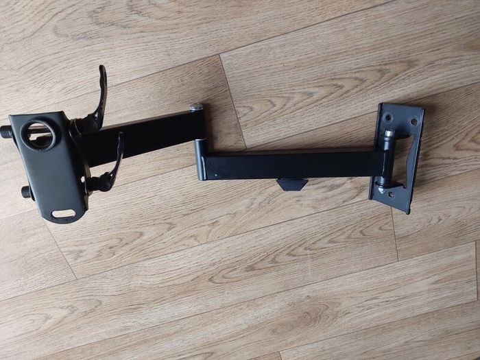 Heavy-duty adjustable monitor/display mounting arm in very good condition.
