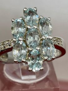 Silver ring with Aquamarine's and Zircons