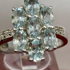 Silver ring with Aquamarine's and Zircons