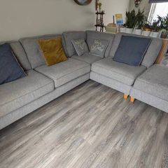 Gray fabric corner chase sofa with footstool