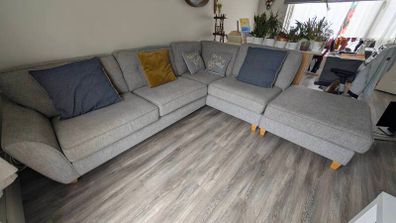 Gray fabric corner chase sofa with footstool