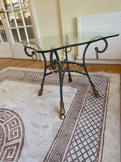 A matching pair of glass tables