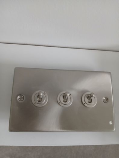 Brushed steel toggle light switches - 3 and 4 gang