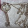 Pandora sterling silver key necklace with a heart,shaped floating locket and pink sparkling stones. Includes the two petite charms Image 10