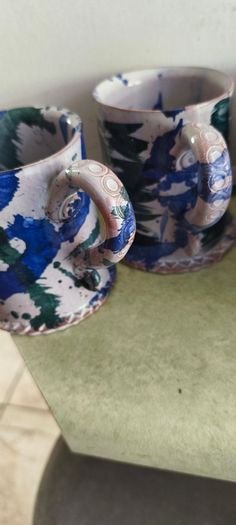 Set of 4 Irish pottery mugs featuring blue and green marbled glazes