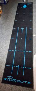 Puttout mat with Pressure Putt Golf Trainer