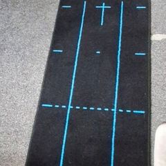 Puttout mat with Pressure Putt Golf Trainer