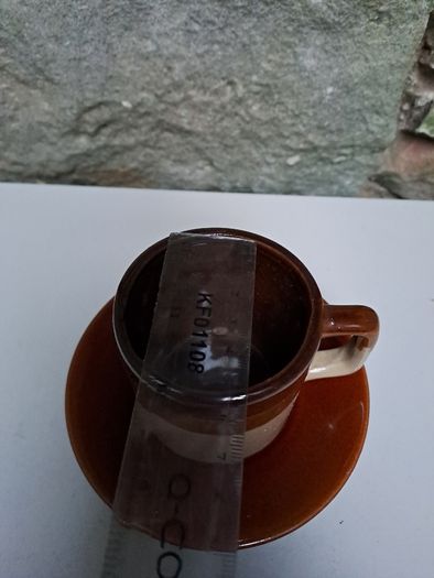 Dark and light brown cup and saucer
