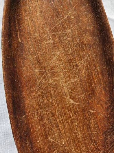Hand-carved leaf-shaped bow