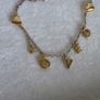 Pandora chain bracelet with gold yellow plated hearts, and dangle letters spelling LOVE adjustable closure with three length options: 16 cm, 18 cm, and 20 cm. In good condition few signs of wear. Image 4