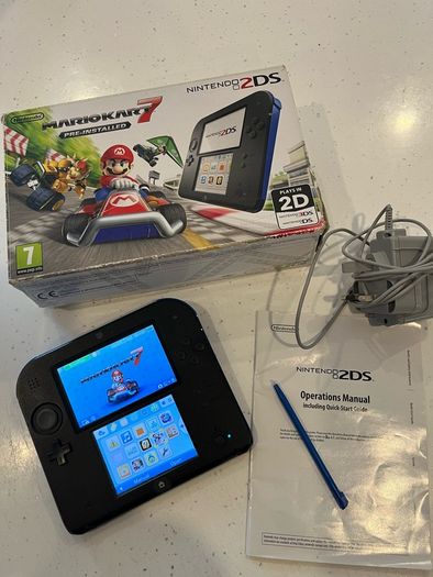 Nintendo 2ds with box and Mario kart game