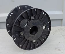 Empty black plastic reel