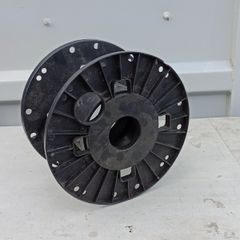 Empty black plastic reel