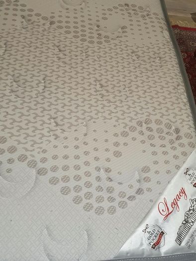 Single divan bed with pristine clean mattress and space for headboard
