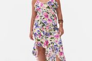 New floral ruffle dress features a vibrant asymmetrical design with delicate tie straps