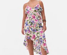 New floral ruffle dress features a vibrant asymmetrical design with delicate tie straps