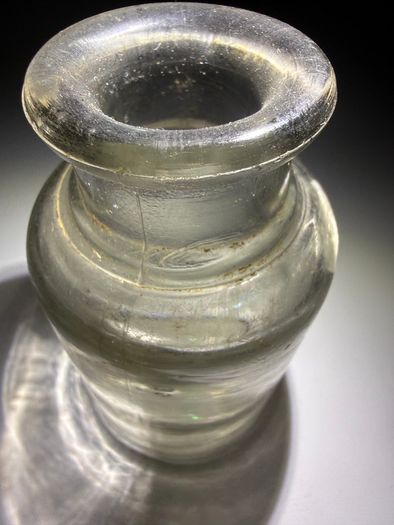 Old clear small glass jar