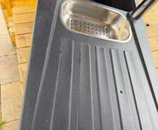 kitchen sink. Black composite double bowl kitchen sink with stainless steel mixer taps 1000mm lx 500mm