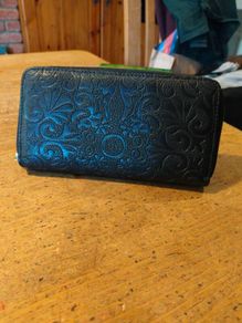 black Dewest zipper wallet.