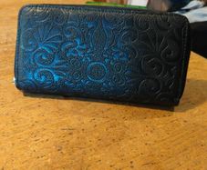 black Dewest zipper wallet.