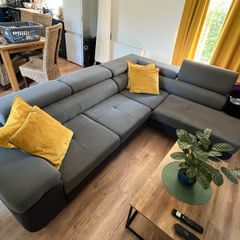 Sofa bed with reclining headrests