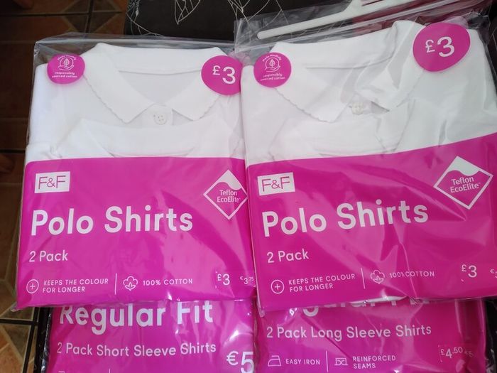 Girls uniform shirts and polo shirts. All brand new in wrappers.
