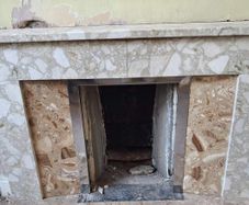 Tiled fireplace with chrome inner surround