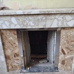 Tiled fireplace with chrome inner surround