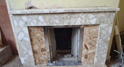 Tiled fireplace with chrome inner surround