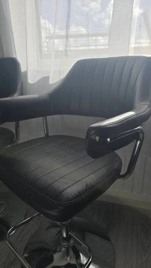 Adjustable black faux leather swivel bar stool with a metal base x3