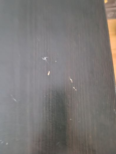 Black dining table with four chairs