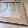Original IKEA BESTA cabinet door/front panel in discontinued natural oak finish with clear glass centre. Image 5