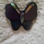 A striking vintage butterfly pendant necklace by Accessorize, featuring iridescent mother of pearl / abalone shell set within black, purple and deep blue resin. Image 2