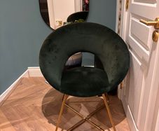 Dark green velvet moon chair with gold legs