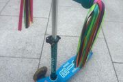 Mini micro scooter with micro scooter tassels