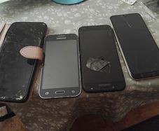 Selection of mobile phones.  Needs repairs