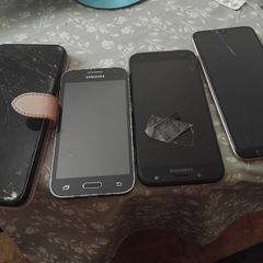 Selection of mobile phones.  Needs repairs