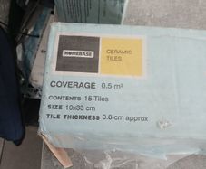 ceramic wall tiles  four boxes just one tile chipped  as show in pics  otherwise all perfect  matt dark grey colour