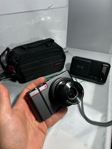 TPanasonic Lumix DMC-ZS100 ,digital camera, featuring a 20.1-megapixel