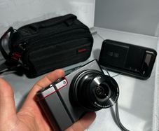TPanasonic Lumix DMC-ZS100 ,digital camera, featuring a 20.1-megapixel