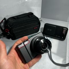 TPanasonic Lumix DMC-ZS100 ,digital camera, featuring a 20.1-megapixel