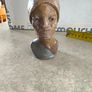 vintage image shows a handcrafted stone bust of a woman wearing a headscarf, often associated with Shona sculpture be carved from fruit serpentine stone from Zimbabwe Image 9